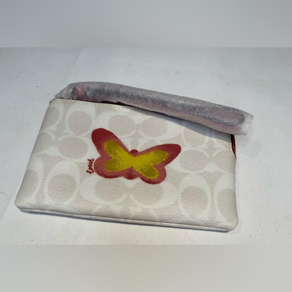NwT Coach White Butterfly Wristlet with Yellow and Red Accents. Beautiful